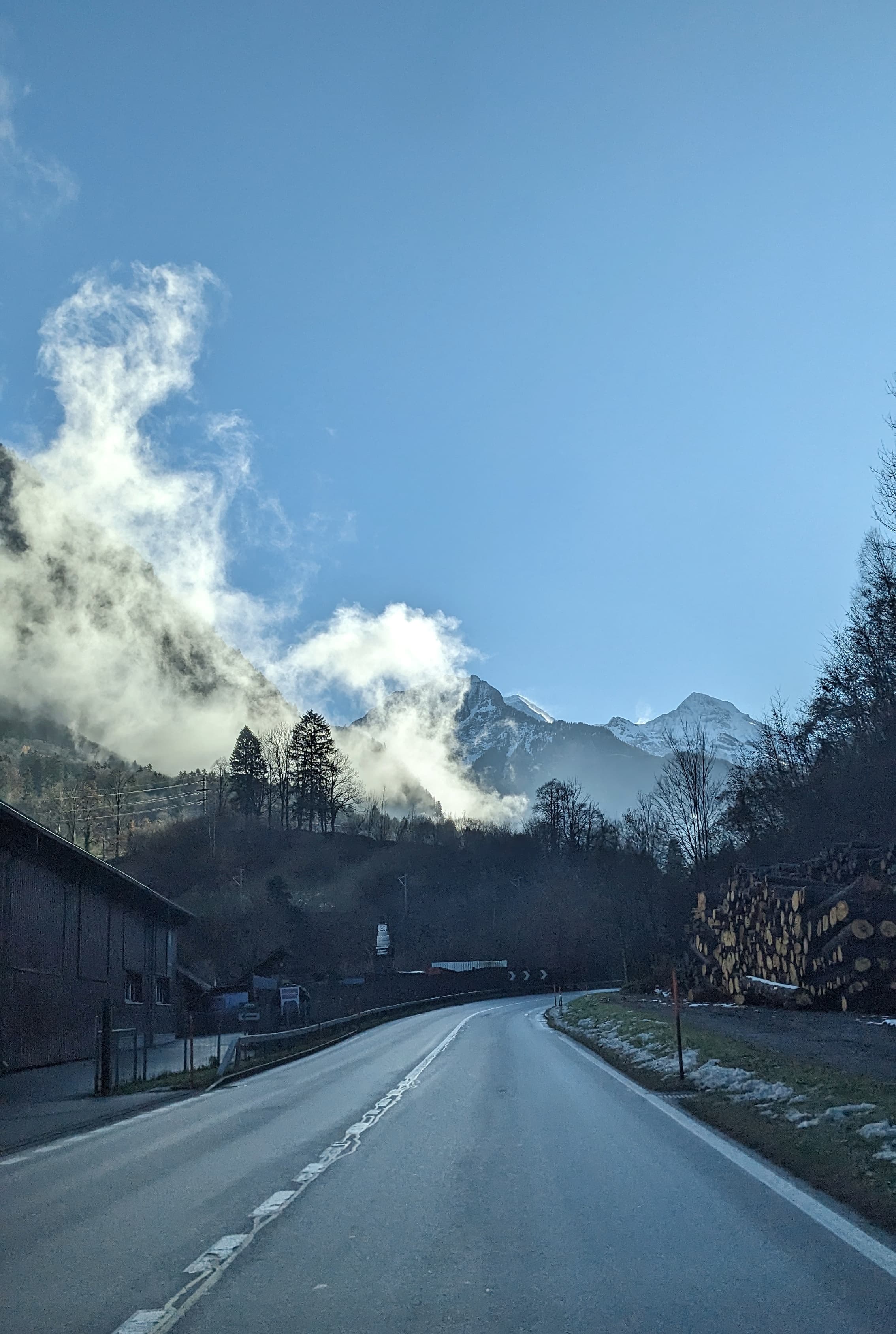 The Lauterbrunnen Valley with sun-kissed fog in the Swiss Alps