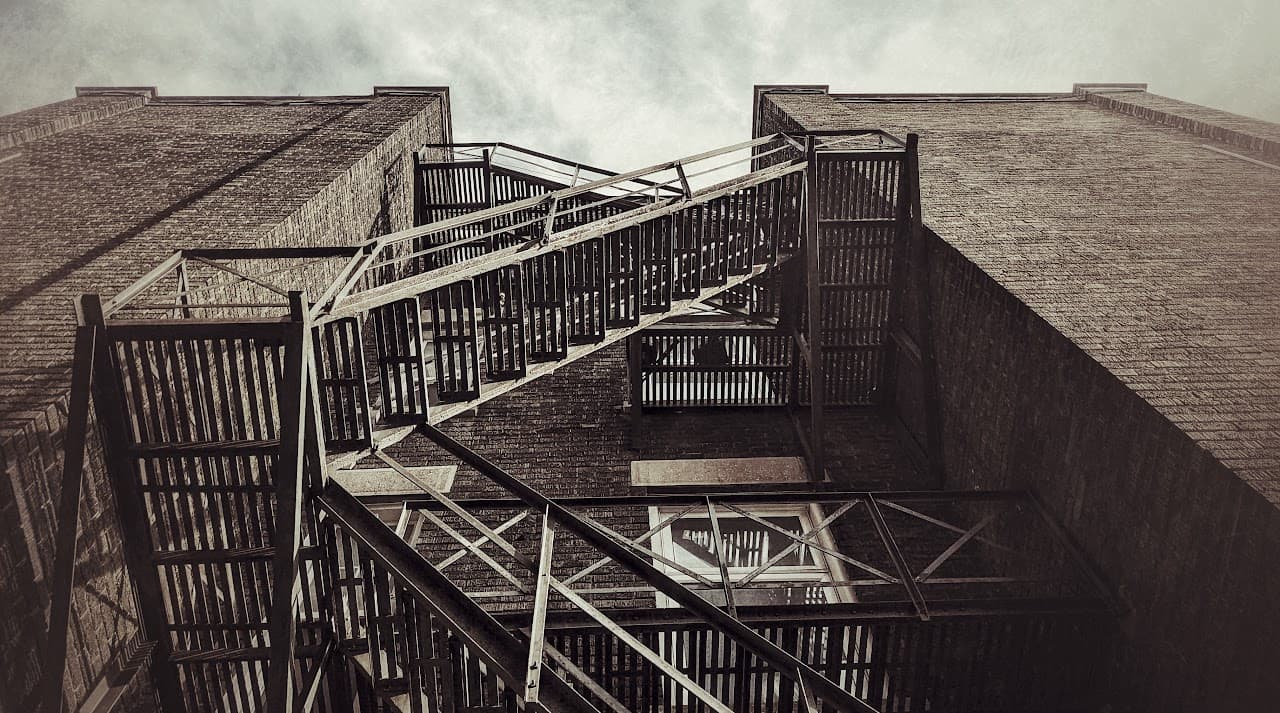 The fire escape on the side of a decrepit building in Ottawa shows old meeting new